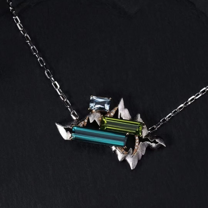 Titanium pendant necklace with geometric multicolor lab-grown gemstones, modern prism design from Elysia’s Titanium Collection